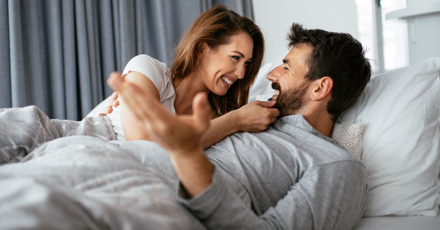 Couple At Home In Bed