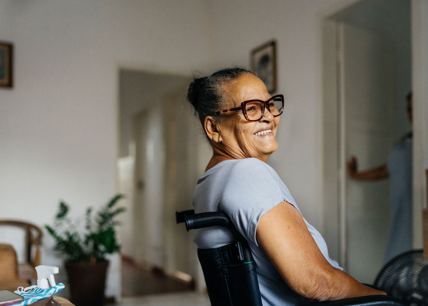 Elderly woman in a wheelchair.