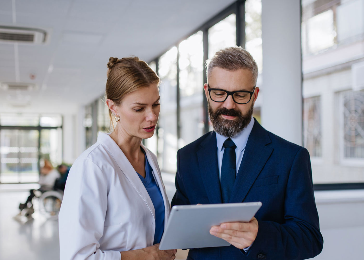 Pharmacist and doctor talking.