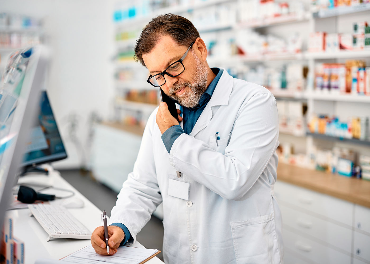 Pharmacist talking on the phone.