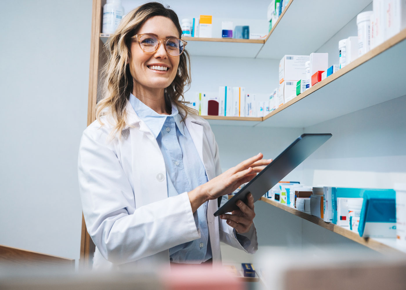 Pharmacist with a tablet.