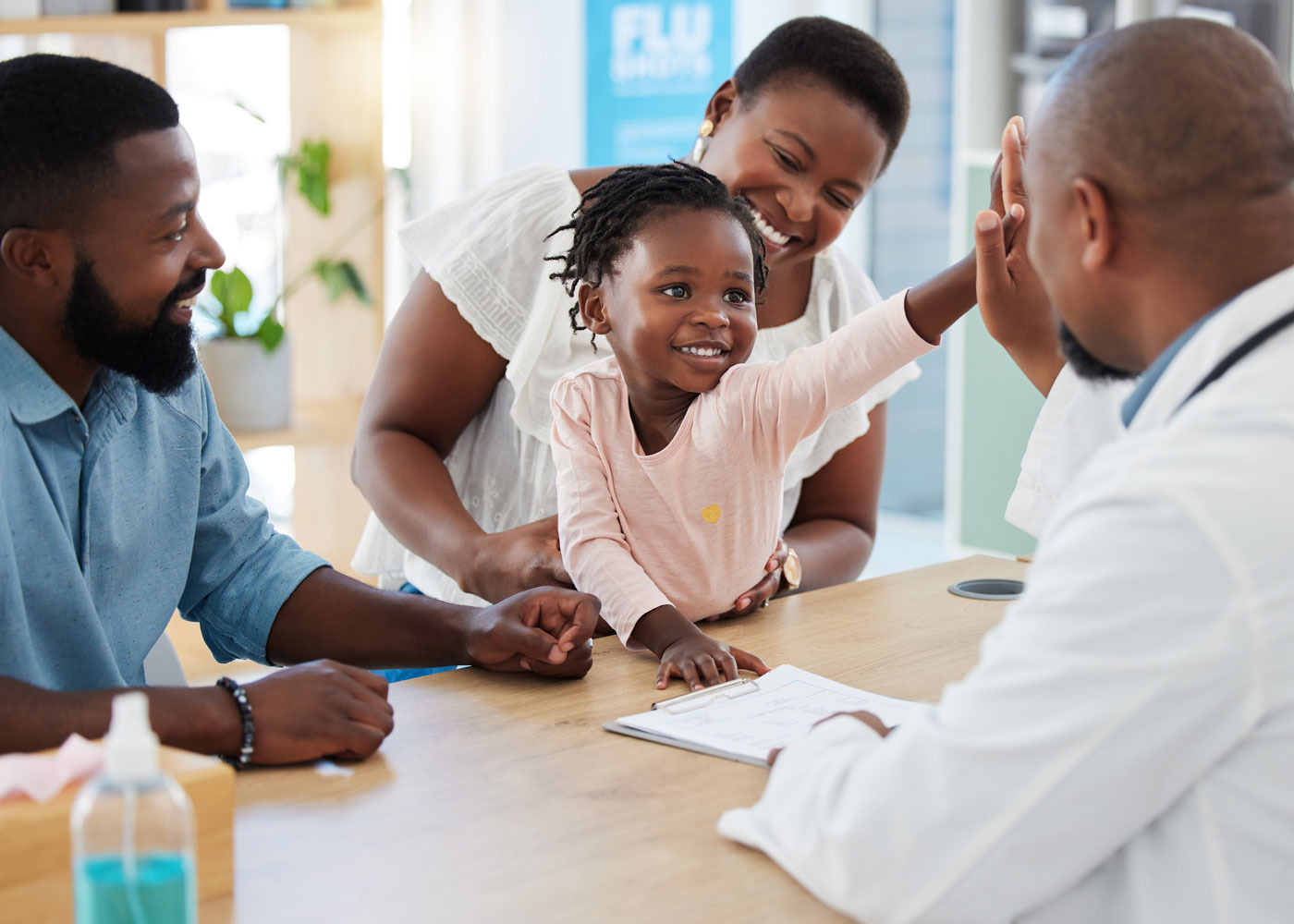 Young family with pediatrician.